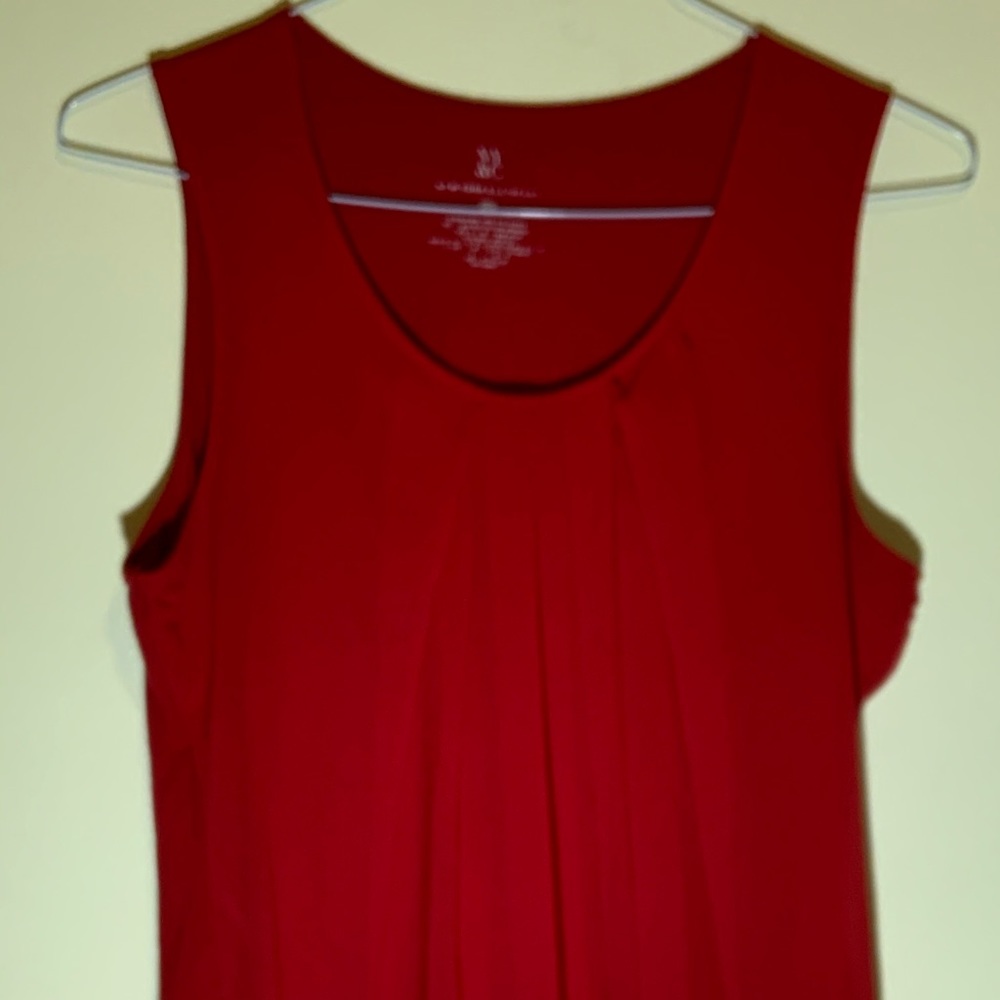 Sleeveless red shirt. Over layer very attractive